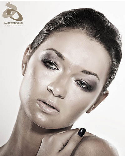 Great looking skin - I love the way this model looks.. Her nice silvery makeup compliments her lovely cheekbones. And her expression fits her to be a model... if this woman were a statue, she'd be immortalized in museums of art... I wish I had this kind of beauty! =)