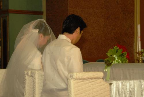 The Bride and Groom - The bride and groom at the altar