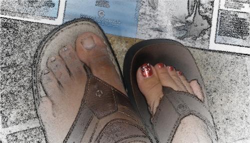 our feet - his and mine - our feet. His feet -manly. My feet- womanly, adorned with nail art.
