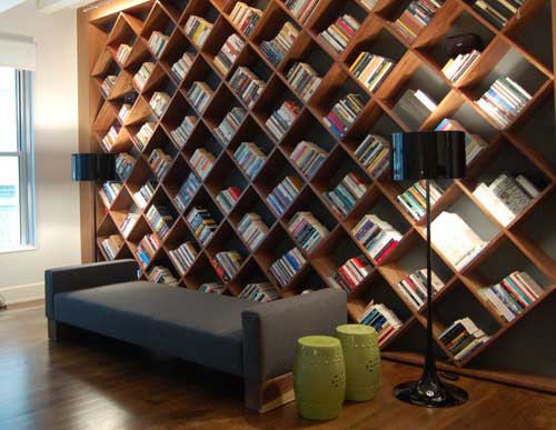do you like this bookshelf - I like the bookshelf very much.How about you?I want to build a same one to my house if i will buy a new house.I think that I can put many many books into it and can get it easy when i want to read it.So nice life i have.Another side have a TV,and video,I also can put some news pager or something else into the bookshelf.Welcome you come to my house.  Do you like it?hehe~~