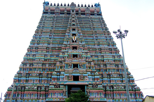 Sri Rangam Temple - This temple covers an area of 600 acres and is the largest temple of India. It was built between 11th and 17th century and several additions were made to the complex by the Cholas, Cheras, Pandyas, Hoysalas, Vijayanagara rulers and the Nayaka of Madurai. The13 storied Rajagopuram at the first wall on the southern side was built in 1987. It rises to a height of 72 meters and is perhaps the tallest in India. Besides Rajagopuram, there are 20 beautifully decorated gopurams in the temple complex.
The main sanctum with a golden Ranga Vimana is set at the center of the inner most prakaram and is dedicated to Lord Vishnu as Renganatha. Ranganatha, the main deity enshrined in the sanctum is depicted reclining on the serpent Adisesha and flanked by idols of his consorts Bhoodevi and Sridevi and the small utsavar or festival idol.
Sri Rangam Temple - This temple covers an area of 600 acres and is the largest temple of India. It was built between 11th and 17th century and several additions were made to the complex by the Cholas, Cheras, Pandyas, Hoysalas, Vijayanagara rulers and the Nayaka of Madurai. The13 storied Rajagopuram at the first wall on the southern side was built in 1987. It rises to a height of 72 meters and is perhaps the tallest in India. Besides Rajagopuram, there are 20 beautifully decorated gopurams in the temple complex.
The main sanctum with a golden Ranga Vimana is set at the center of the inner most prakaram and is dedicated to Lord Vishnu as Renganatha. Ranganatha, the main deity enshrined in the sanctum is depicted reclining on the serpent Adisesha and flanked by idols of his consorts Bhoodevi and Sridevi and the small utsavar or festival idol.