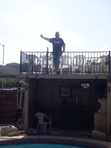 Balcony - This is a picture of my uncles outdoor balcony that he built. It had a great view of the road andyou got a lot of sun from sitting up there. I spent most of my days catching some sun and just relaxing.