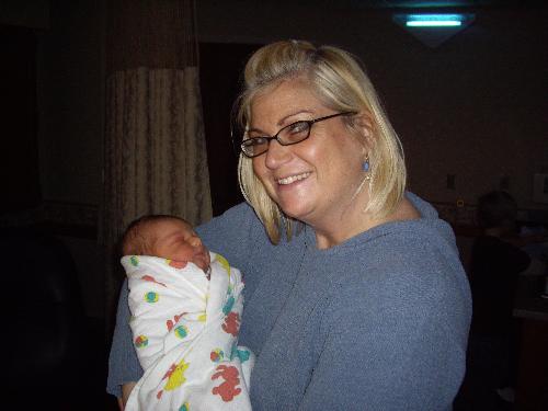 Aunt - This is a picture of my aunt holding he daughter, she is a great mother and I respect her sooo much for the work that she does. She is a very powerful woman and I love her for that and stands up for he beliefs.