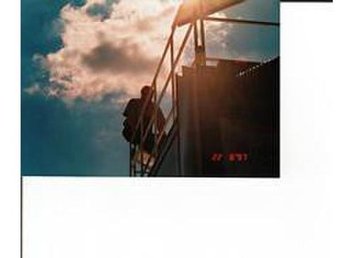 Dale Earnhardt Senior sitting on top of his hauler - Yes that is the late great Dale Earnhardt. I took the picture years ago while at the Bristol Motor Speedway night race..