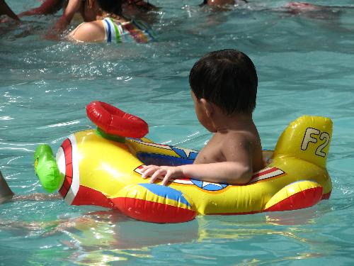 floating unaware - Son of my friend in a swimming party somewhere in Cainta Rizal, Philippines.