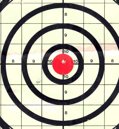 close up shot of my bulls eye!!! - Here's a close up shot of my Bulls Eye, the paper is way bigger than my scanner but you can clearly see where the bullet went  right smack dab dead center!!!
