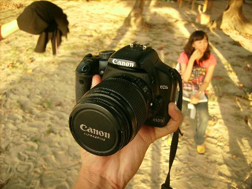 Canon EOS 450D - 12.2 Megapixel CMOS sensor The 12.2 Megapixel CMOS sensor gives you plenty of detail for poster-size prints and extra flexibility when cropping. Sensitive in low light and virtually noise-free, Canon’s CMOS sensors are also remarkably power-efficient.  3.5 fps shooting The EOS 450D captures up to 3.5 frames per second for a continuous burst of up to 53 large JPEG images (6 in RAW).   9-point wide-area AF The 9 AF points are spread out across the frame to better accommodate off-centre subjects. The central AF point is a high sensitivity cross type sensor for quick, accurate focusing with f/2.8 and faster lenses.  EOS Integrated Cleaning System Canon’s built-in dust prevention system uses three methods to keep images blemish-free. (1) Specialised materials reduce dust generation within the camera. (2) A Self-Cleaning Sensor Unit shakes dust from the sensor each time the camera is turned on or off. (3) Stubborn dust spots are mapped for easy removal in Digital Photo Professional.  3.0” LCD with Live View mode The bright 3.0” LCD provides sharp definition for checking focus and composition, with 10x magnification for finer details. When shooting from awkward positions, Live View mode gives you the option of framing the image from the LCD, and a choice of focussing modes.   DIGIC III processor Renowned for its white balance accuracy, DIGIC III renders colours with brilliant, true-to-life precision. Captured images are processed in 14-bit colour depth for finer tonal gradations. DIGIC III works efficiently to minimise power consumption while maintaining ultra-fast response times.  Large, bright viewfinder A large viewfinder gives a bright and clear view for easy composition of the scene.   Total image control Gain easy control over image processing parameters with Picture Style presets. Contrast, sharpness and saturation can be customized in-camera or through the supplied Picture Style Editor software. After the shoot, Canon’s RAW processing software Digital Photo Professional provides everything you need to manage and process your RAW images.  Compact and lightweight Ergonomically designed for natural and intuitive handling, the EOS 450 is housed in a compact body that weighs in at just 475 grams.  EF lenses and accessories The EOS 450D is compatible with over 60 EF/EF-S lenses and all EX Series Speedlite flash units.    - http://www.canon.co.uk/For_Home/Product_Finder/Cameras/Digital_SLR/EOS_450D/index.asp