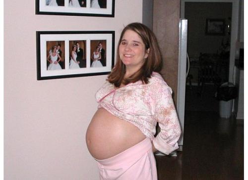 Pregnant four months with triplets..  - I know I was huge.