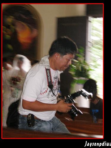 d Photographer - a photographer's blocking my way to shoot the bride