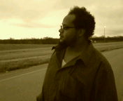 My hubby - This is my handsome man. We were on a road trip home from Emporia (a small and boring town in KS). I just like it because its a great picture, but I think it shows how even when he's just standing around he is always deep in thought about the problems of the world.