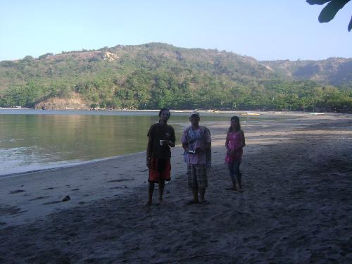 three at the beach - the three at the beach early morning having talk and walk