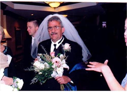 My dad.. the one that raised me - on my wedding day wearing my veil, so he is a tad fun at times.