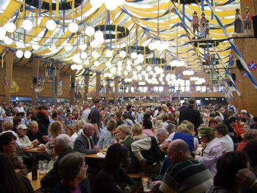 An Oktoberfest tent. - The Oktoberfest takes place in Munich each year . It lasts for two weeks and finishes on the first Sunday of October. Thousands of people come from all over the world.
This picture shows only a small part of one of the 14 huge "tents".