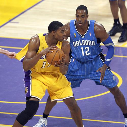 Lakers VS Magic Game 1 - While getting his jersey tugged, Bynum prepares for a post play against superman.