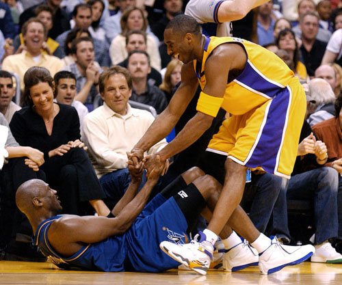 Kobe & MJ - Kobe is trying to give old Jordan a hand during one of their match when MJ still plays for the Wizards..