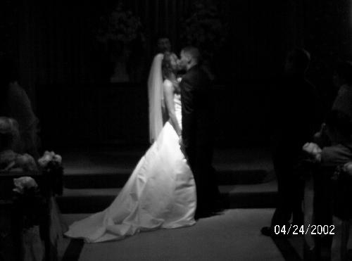 My brother and sister in law on their wedding day - My brother and sister in law kissing on their wedding day.