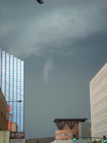 Birth of Tornado in Denver, Colorado - I was outside watching the weather and a person screaming at me in a distance, 'Go to a shelter.' Why the heck he screamed at me? I realized it was a tornado warning in Denver, Colorado. I was just right there, standing outside. I pulled out my camera and captured the moment. Well, it died within few minutes and did not touch down the ground. I was all excited.