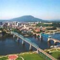 Picture of Chattanooga, TN - This is a picture of Chattanooga, the closest city to me. There are 4 bridges that cross the Chattanooga River in downtown...three are driving bridges and one is only a walking bridge. The bridges in this picture are of the Walnut Street Bridge and the Market Street Bridge. The Market Street bridge is the blue one and the Walnut Street Bridge is just a walking bridge. The 'Walking Bridge' as it is commonly known is the 2nd largest walking bridge in the nation. The walk across the river is a wonderful walk. One one end is a wonderful shopping area with a newly rennovated park and on the other side is Chattanooga's art district with museaums and great restaurants.