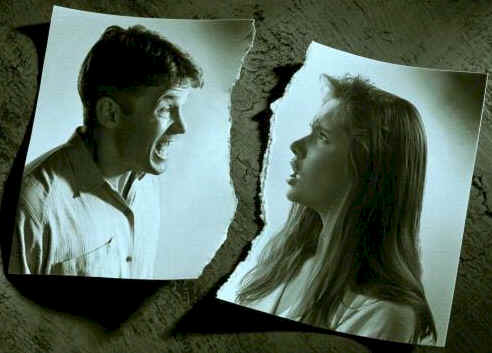 Loveless Marriage - The image of a picture torn in half portrays of couples with a loveless bad marriage.