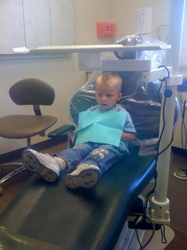 My three year old's first visit to the dentist. Th - My three year old's first visit to the dentist. They let him wear cool sunglasses to protect his eyes.