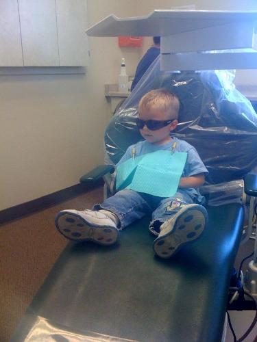 My three year old's first visit to the dentist. Th - My three year old's first visit to the dentist. They let him wear cool sunglasses to protect his eyes.
