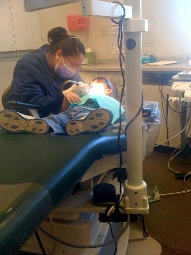 My three year old's first visit to the dentist. Th - My three year old's first visit to the dentist. They let him wear cool sunglasses to protect his eyes.