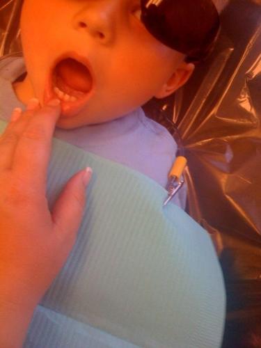 My three year old's first visit to the dentist. Th - My three year old's first visit to the dentist. They let him wear cool sunglasses to protect his eyes.