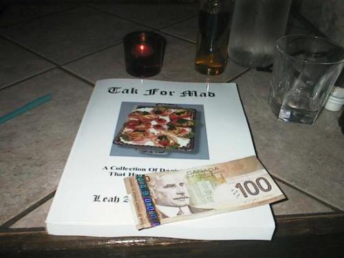 A Book And A Profit. - This was to celebrate the first batch of books I ever sold, way back in 2006. I took this picture of my first payment sitting atop a copy of my cookbook. The title is 'Tak For Mad' which is Danish for 'Thanks for the good,' and is written in memory of my Danish grandparents/