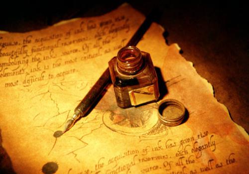 Writing - Writing the old fashioned way with ink, a pen, and a piece of parchment