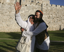 A Hug for All Mankind - A Palestinian and Israeli hugging in front of Jerusalems Old City during the third annual Jerusalem hug.
