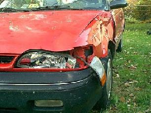 Poor car! - This is the damage done by the deer. You can't really see the windshild damage, but it was cracked in the lower left corner and eventually spread all the way across the glass. This was $2,000.00 worth of damage 10 years ago!