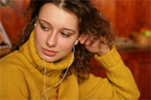 Music - Woman listening to personal stereo