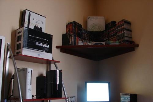 3 consoles - A Playstation2, a playstation3 and a Xbox360, side by side.