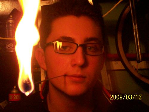 Fire eating prep - Me mentally preparing for my fire eaqting stunt... me smoking the flame(I don t smoke)