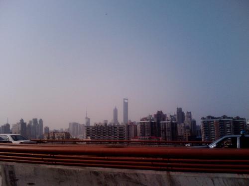 A picture of Shanghai  - I took this photo by mobile phone. And you can see the three highest buildings of Shanghai, they are located very near each other.