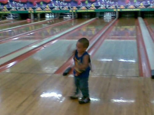 baby bowling - a photo of a young boy inside the bowling area