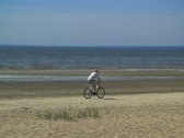 Travel by cycle - Cycling alone on a vast plane.