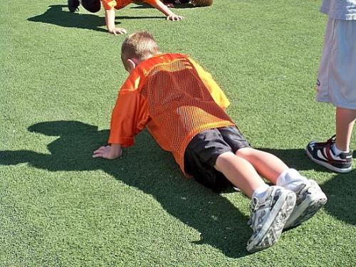 My seven year old son, Cody doing a push up at foo - My seven year old son, Cody doing a push up at football camp