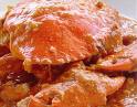 Chilli Crab in Singapore - Chilli Crab is consisdered the unofficial 'National Dish' of Singapore. This dish is very popular with locals as well as the tourists in Singapore. The crabs are cooked in a yummy thick chilli/tomato based gravy. Chilli crabs are often served with a few slices of bread or fried mantou (chinese bun).