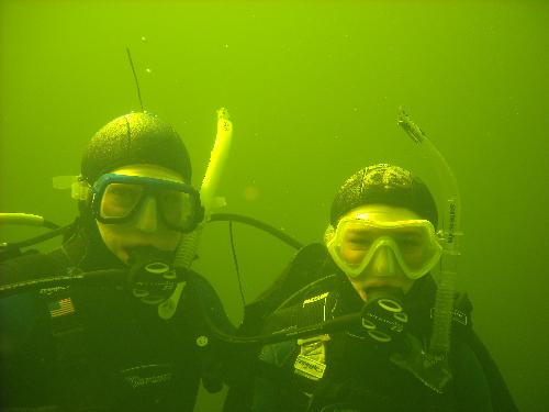 under water - me and my mom scuba diving in the quarry in nc, we saw six bass