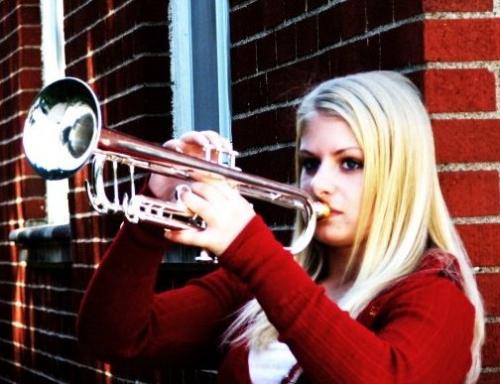 Picture with Trumpet - This is a picture of myself with my Xeno trumpet. I adjusted the colors to accent the red.