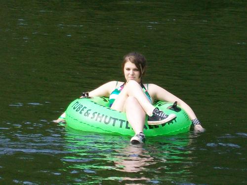 My oldest daughter Kimber - Here she is taking it easy on a calmer part of the river. She's been roughed up a little but she's hanging in there.