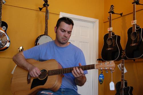 Me playing guitar - Me playing a Cole Clark acoustic guitar.