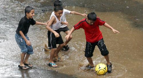Playing in rains!!!!!!!! - These kids rocks!!!!!!!!!I would like to be one of them.