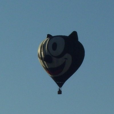 Hot Air Balloon - Felix the Cat cartoon character shaped hot air balloon flying over Jackson Michigan during Hot Air Jubilee