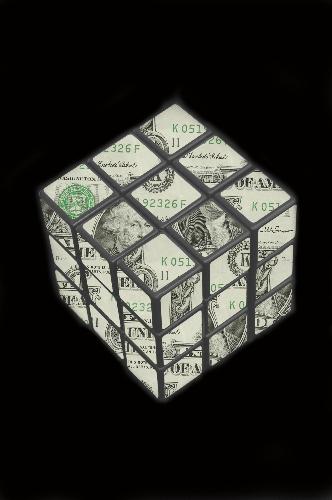 Money rubix cube - Rubix cude with a dollar bill imposed on it