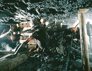 gold mines,south africa - Worker are on the way to get gold out of earth in a mine,One of the gold mines of South Africa, which holds the world&#039;s most productive and deepest gold mine. At nearly two and a half miles (four kilometers) deep, temperatures in the Western Deep Level can reach more than 100 degrees Fahrenheit (42 degrees Celsius).
