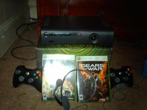 Xbox 360 (2) - Again my xbox 360 console I got a story in my other picture so if you want to hear about it read that one but this picture is the same as my other one but I put in my controllers and my black headset.