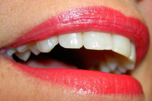 woman smiling - closeup of woman smiling, with white teeth and lipstick