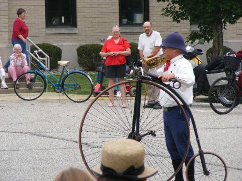 Bugle Call to Mount to Ride at National Wheelman E - This bicyclist is in period costume, and he presents a bugle call to mount for bicylists to ride during a National Wheelmen show at Saint Mary-of-the-Woods, IN on July 10, 2009. Some of the cyclists rode as far as 100 miles during the event.